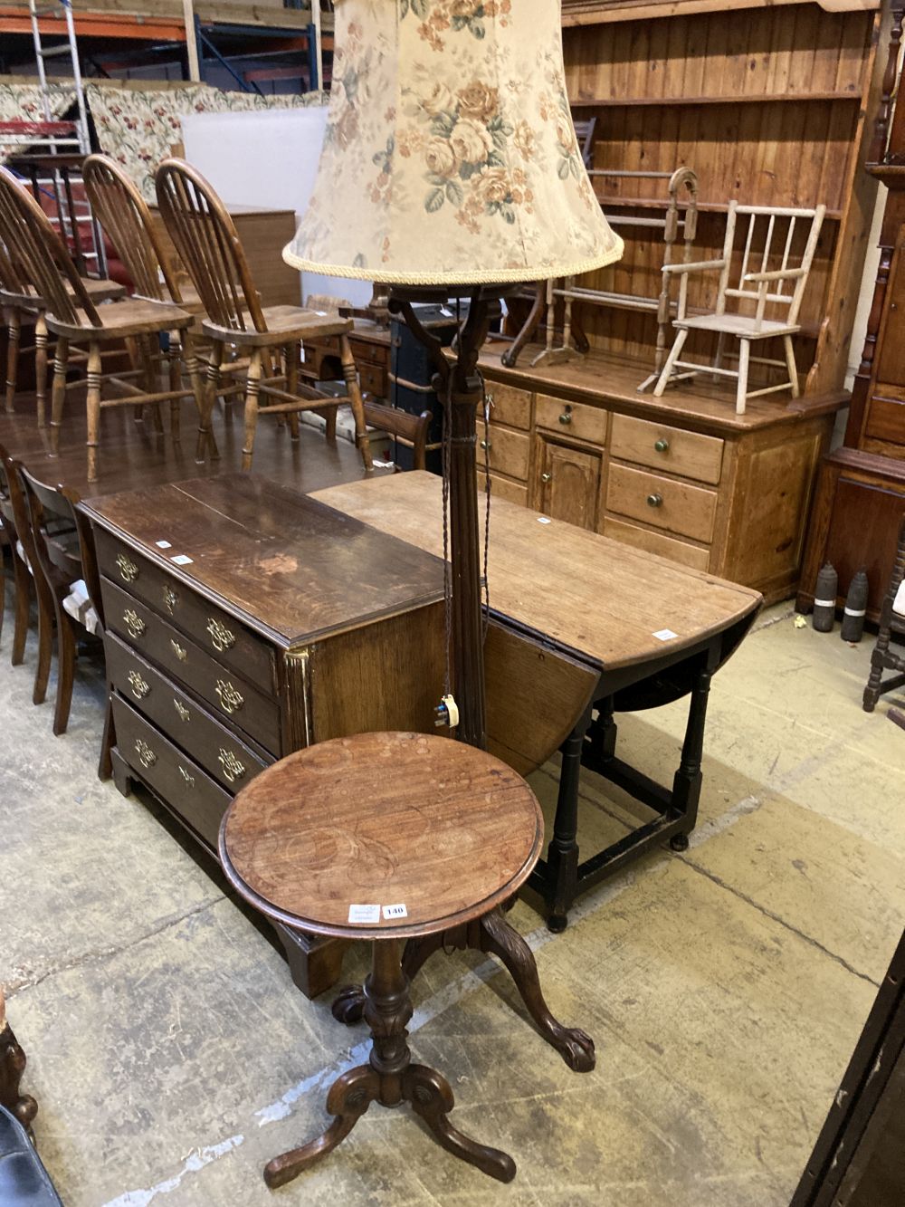 A Victorian mahogany tripod wine table, diameter 50cm height 70cm, together with a carved standard lamp